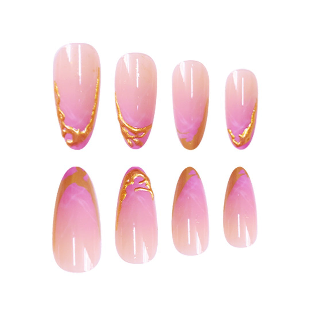 Elegante Stiletto Press-On Nagelerweiterungen mit goldenen Spitzenakzenten Brehn