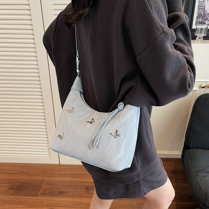 Stylische Handtasche mit Schmetterlingsdetail Brehn