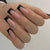 Kunstnagelset mit eleganten Schwarz-Weiß-Farben und Glitzerakzenten Brehn