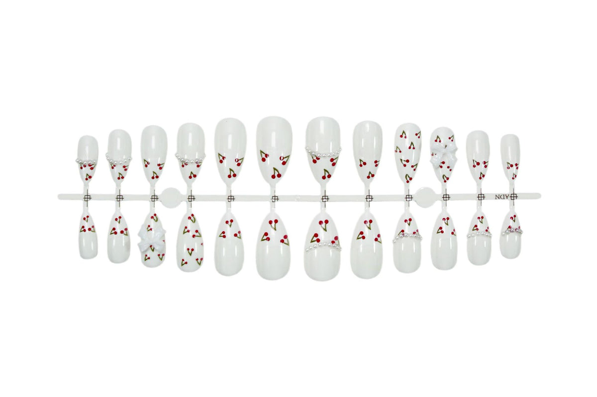 Kunstnagelset mit floralen Cherrymotiven und eleganten Schleifen Brehn