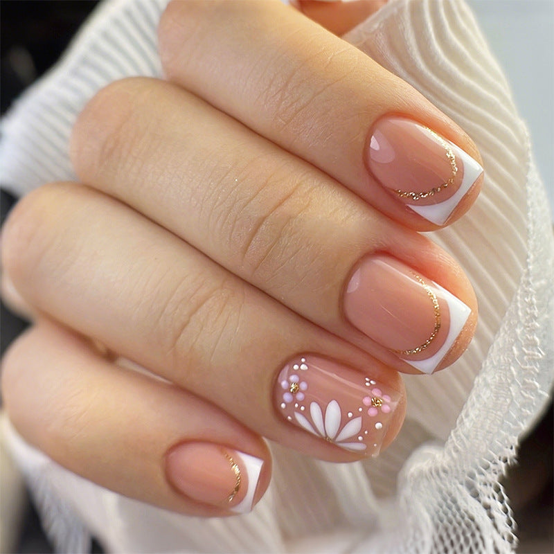 Kunstnagelset mit bunten Blüten und kreativem French-Design Brehn