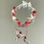 Handgefertigtes florales Schmetterlings-Charm-Armband Brehn