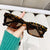 Damen moderne, geometrische Sonnenbrille mit stilvollem, robustem Rahmen Brehn