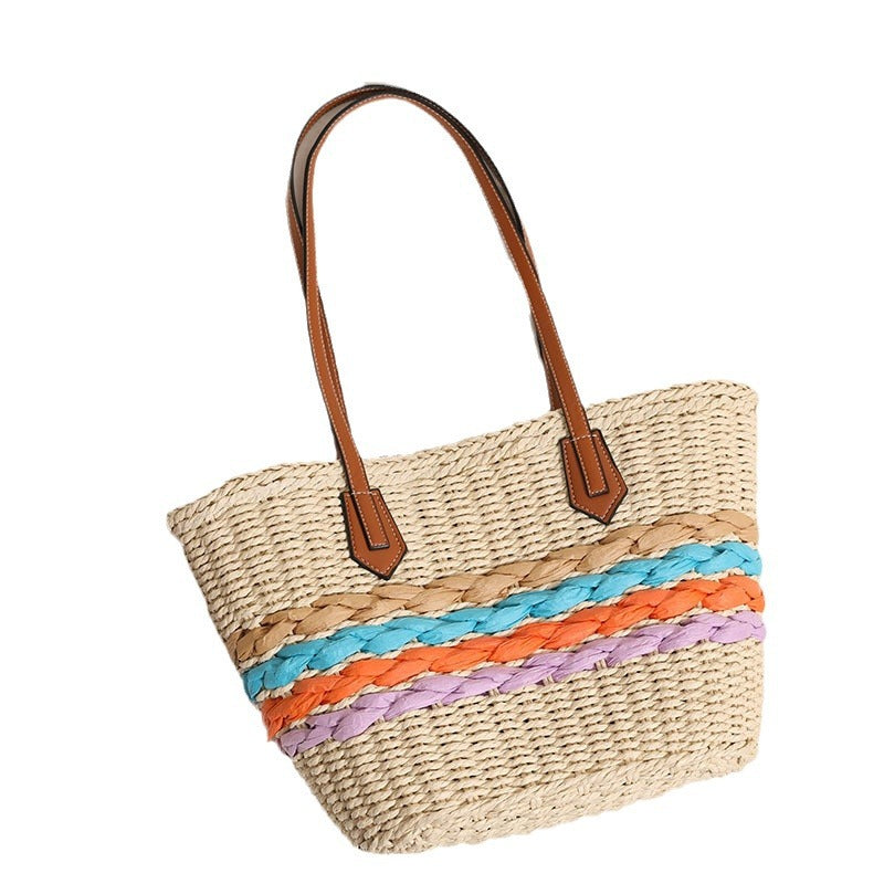 Kurvenreiche Basttasche mit Farbigen Flechtakzenten Brehn