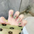 Kunstnagelset mit eleganten Kristallverzierungen Brehn