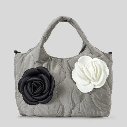 Blumengeschmückte gesteppte Handtasche