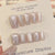 Stilvolles Press-On Nagelkunst-Set mit eleganten Schmetterlings- und Juwelenelementen Brehn