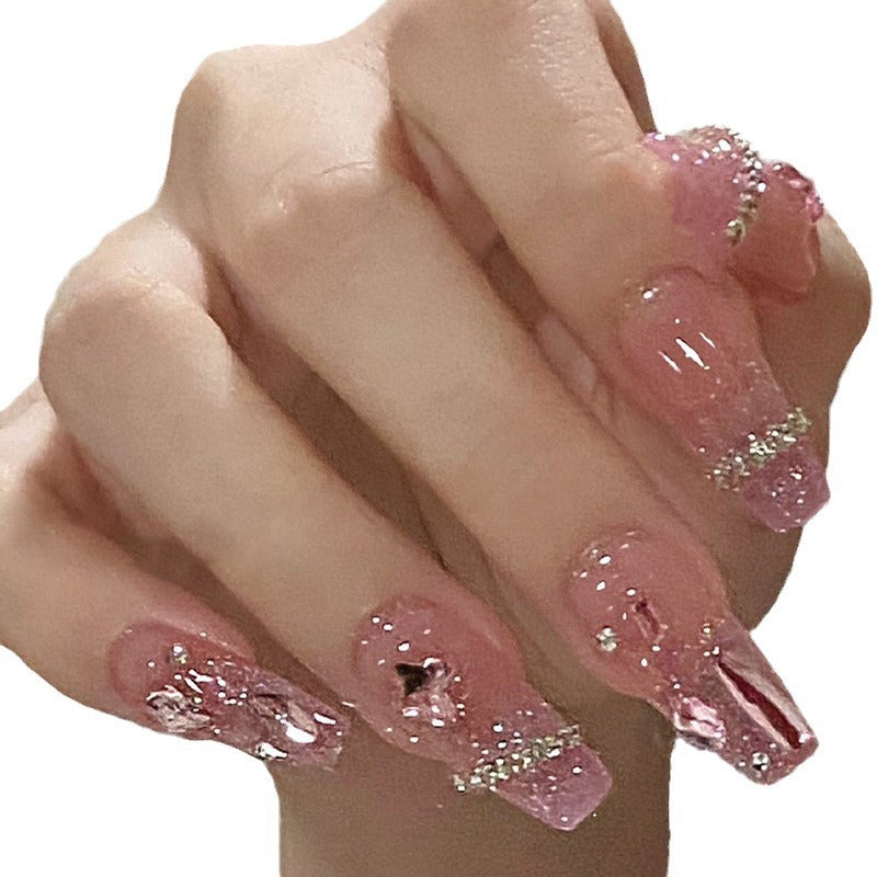 Kunstfingernägel mit Herzmotiv und Glitzerakzenten Brehn
