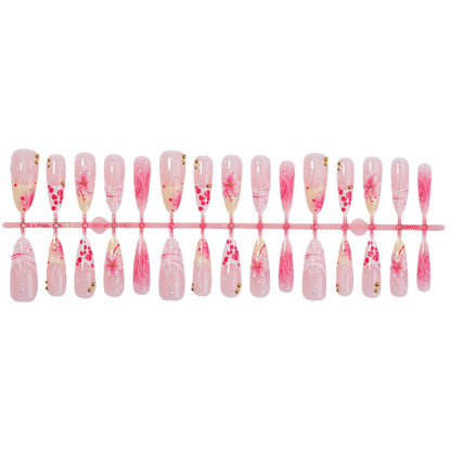 Kreatives Kunstnagelset mit floralen und glitzernden Akzenten Brehn