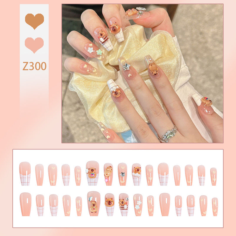 Kunstnagelset mit charmantem Tierdesign und funkelnden Kristallverzierungen Brehn