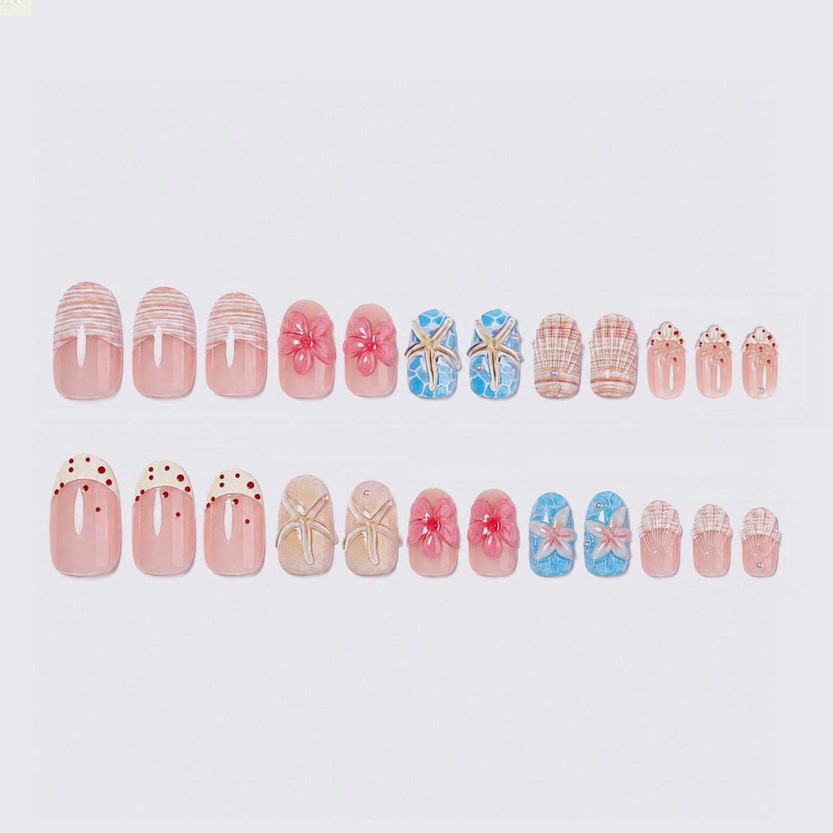 Kunstnagelset mit maritimem Design und floralen Akzenten Brehn