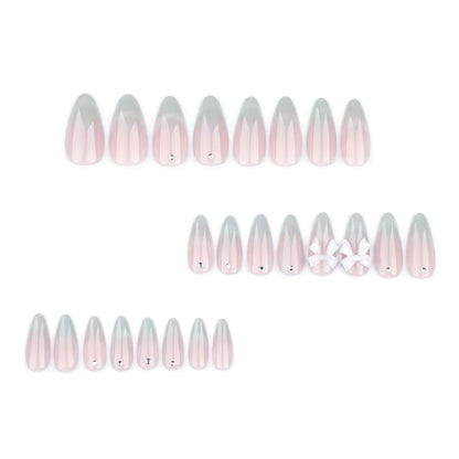 Elegante Stiletto Press-On Nägel mit dekorativer Schleife und Juwelenakzenten Brehn