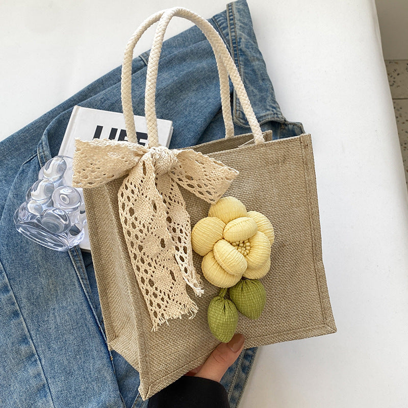 Blumenverzierte Tasche