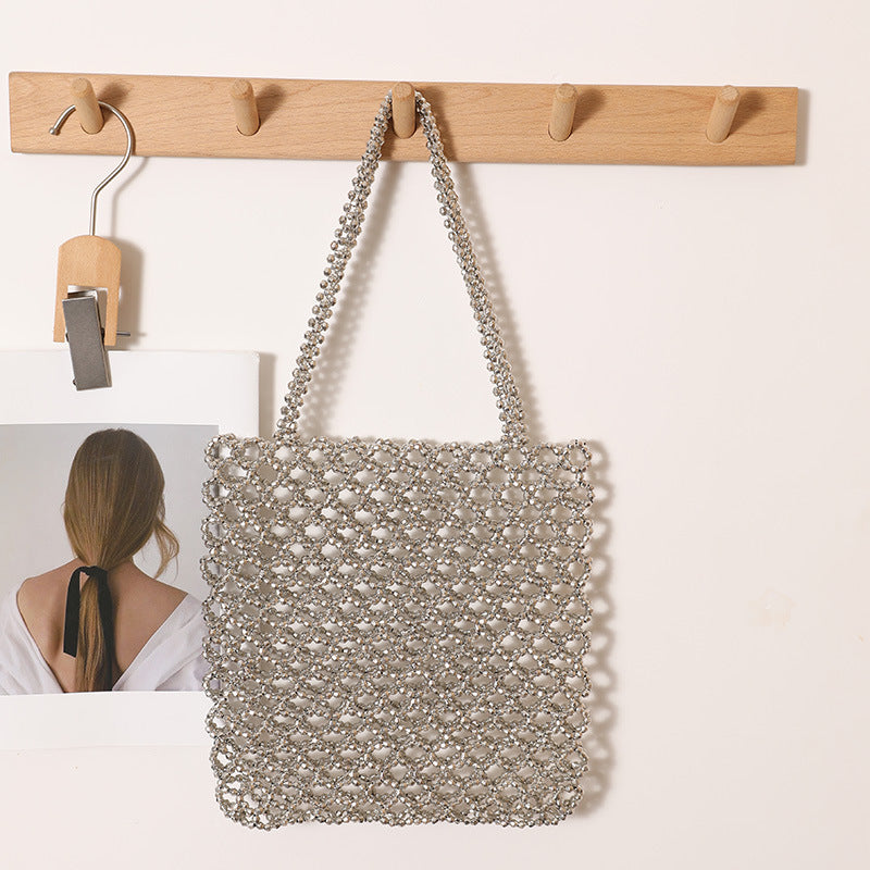 Glitzernde Netzhandtasche Aus Geflochtenem Material Brehn
