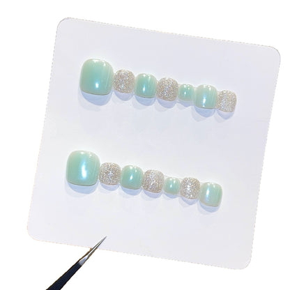 Kunstnagelset mit Glitzer- und Pastellakzent Brehn