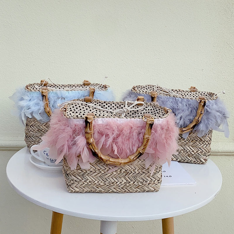 Elegante Handtasche mit Federn und Bambusgriffen Brehn