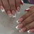 Kunstnagelset mit eleganten French Spitzen und romantischen Herzverzierungen Brehn