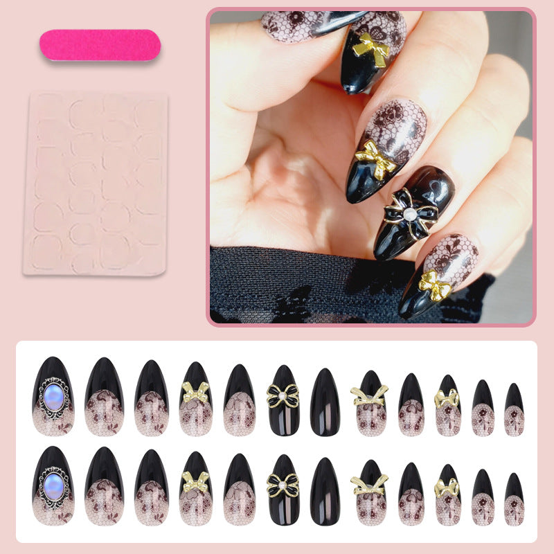Kunstnagelset mit eleganten Punkt- und Schleifenverzierungen Brehn