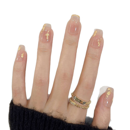 Dekoratives Press-On Nagelkunstset mit goldenen Akzenten
