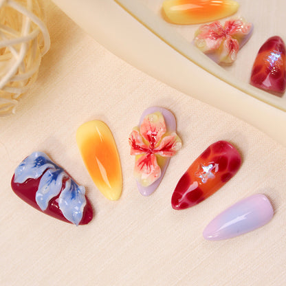 Kunstnagelset mit floralen 3D-Akzenten und bunten Designs Brehn