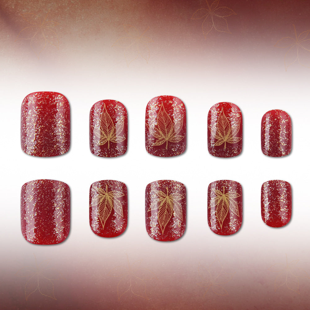 Künstlerisches mit Blättern verziertes Nageldesign Brehn