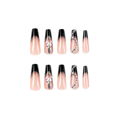 Kunstvolle Stiletto-Nägel mit Glitzerverzierungen Brehn