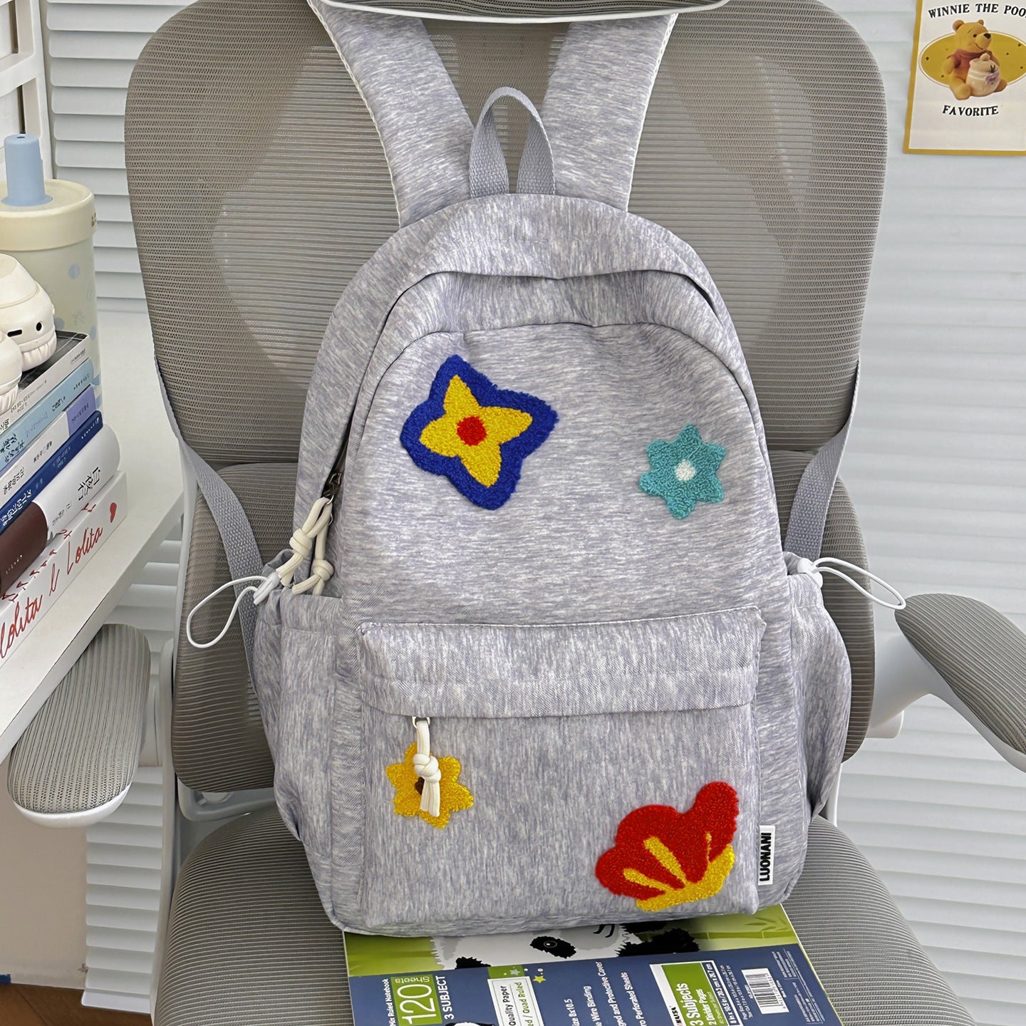 Blumenbestickter Schulrucksack