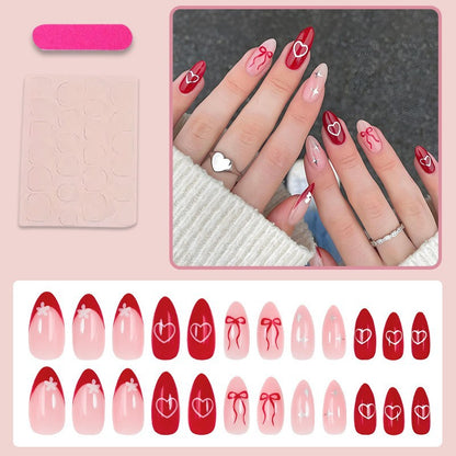 Kunstnagelset mit romantischen Herzen und Schleifen Brehn