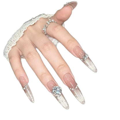 Künstlerische Stiletto-Nagelverlängerungen mit Edelsteinakzenten