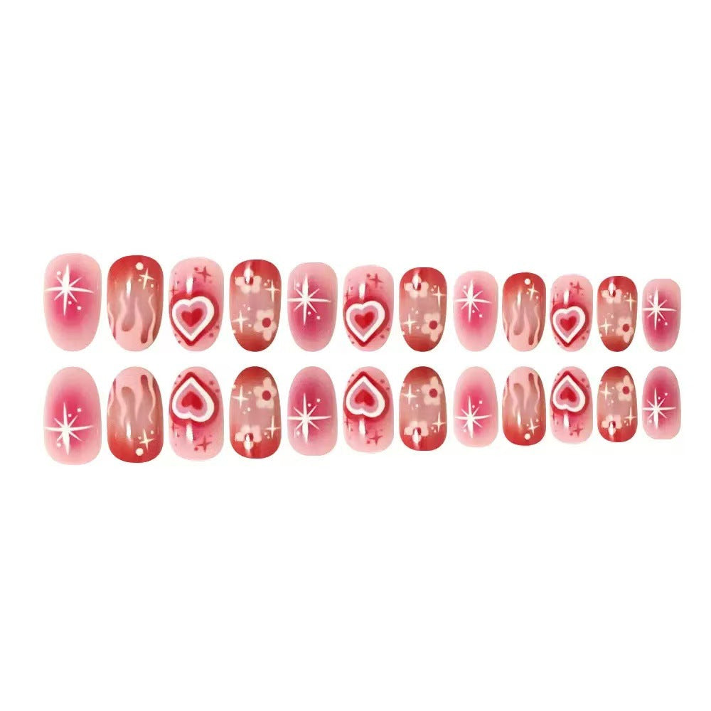 Kunstnagelset mit romantischen Herz-Design und glitzernden Akzenten Brehn