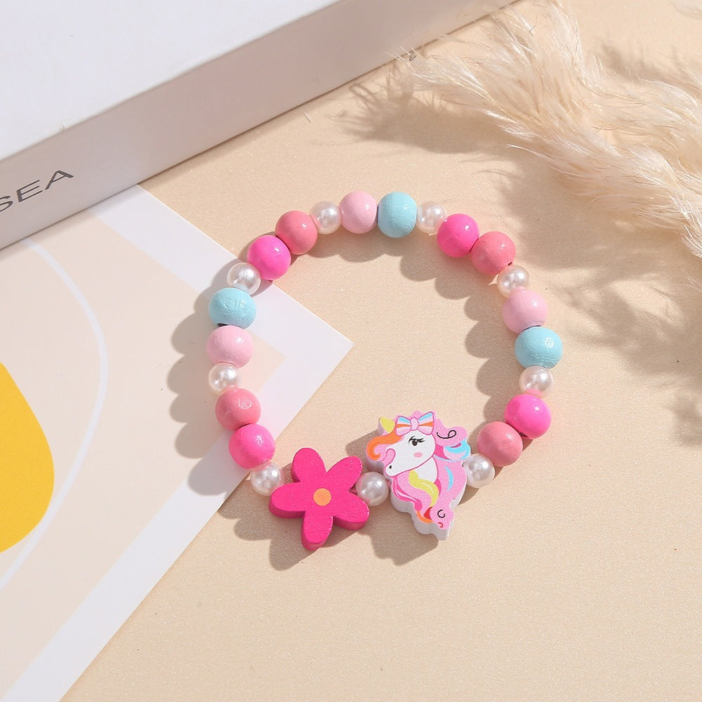 Verspieltes Kinderarmband mit Einhorn- und Blumenmotiv Brehn