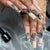 Kunstvolle Nagelkunst mit Schmetterlingsmotiv Brehn