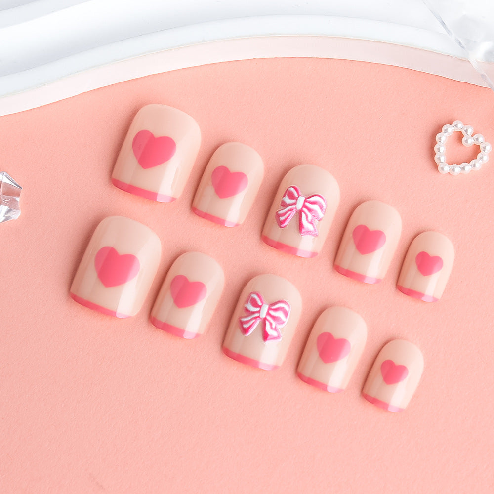 Herz und Schleife Verzierter Press-On Nagelkunst Brehn