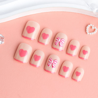 Herz und Schleife Verzierter Press-On Nagelkunst Brehn