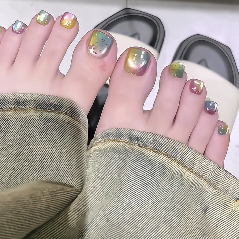 Kunstnagelset mit schimmerndem Farbverlauf und eleganten Designs Brehn