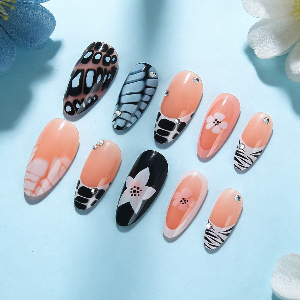 Künstlerisches Press-On Nagelset mit floralem und texturiertem Design Brehn