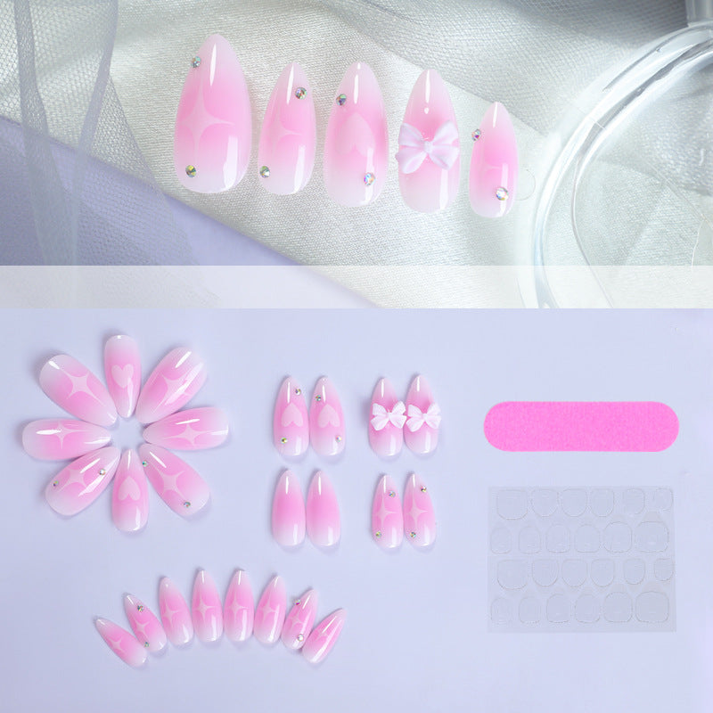 Dekorativer Press-On Nagelset mit Herz- und Schleifenmotiv Brehn