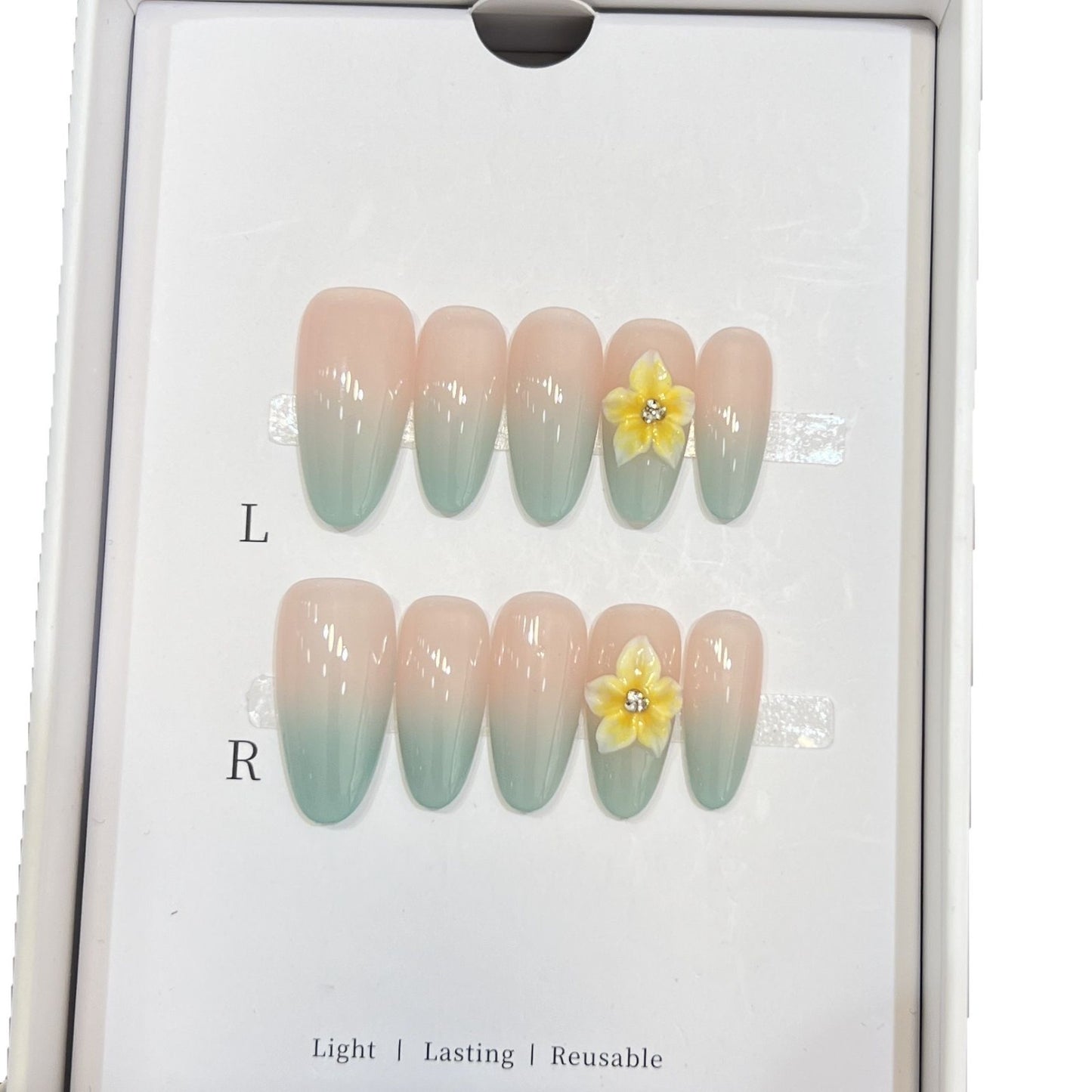 Elegante Ombre Press-On Nagelset mit floralen Akzenten Brehn