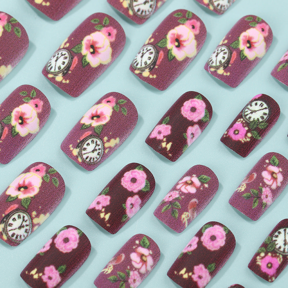 Kunstnägel mit floralen Design und detailreichen Uhrenmotiven Brehn