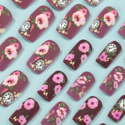 Kunstnägel mit floralen Design und detailreichen Uhrenmotiven Brehn