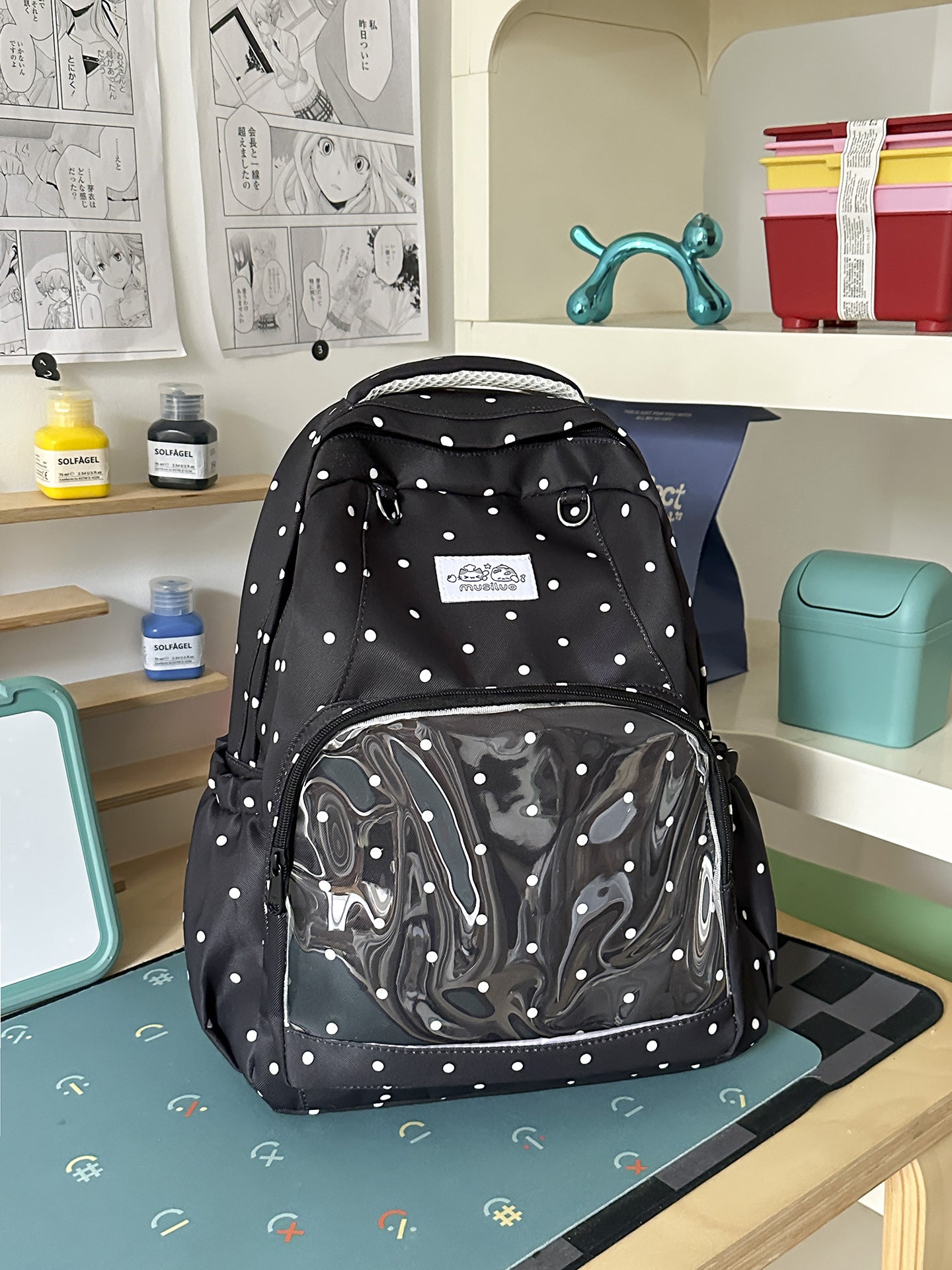 Lustiger gepunkteter Schulrucksack
