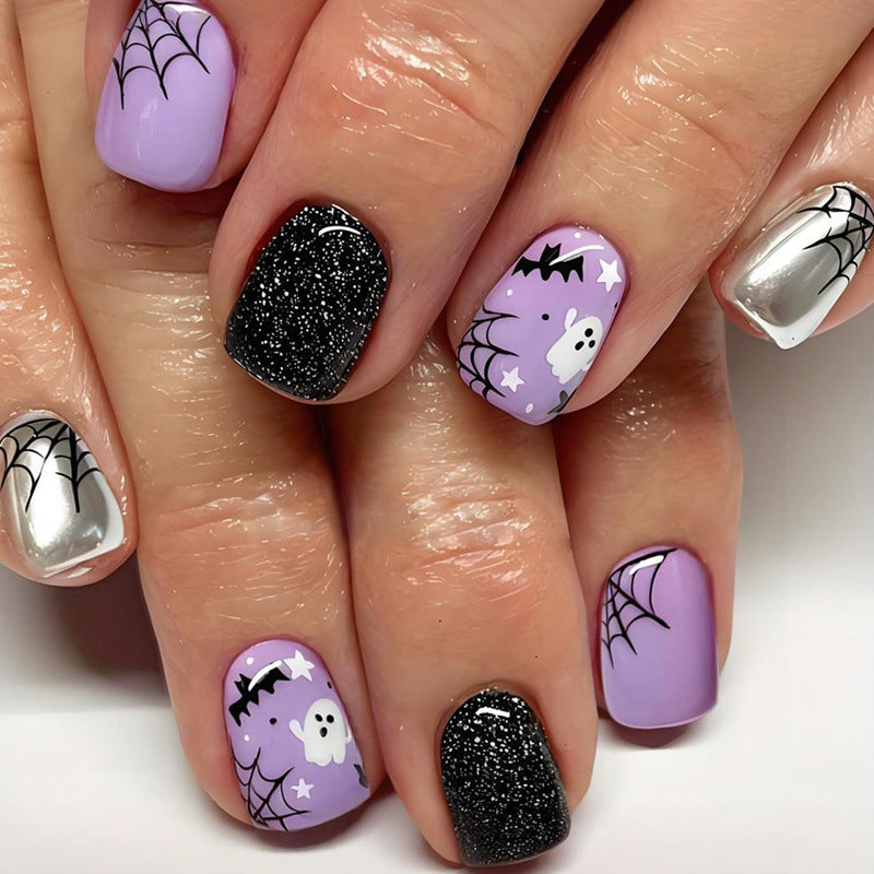 Halloween Kunstnagelset mit spooky Motiven und Glitzerakzenten Brehn