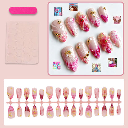 Kunstnagelset mit floralen Mustern und luxuriösen Verzierungen Brehn