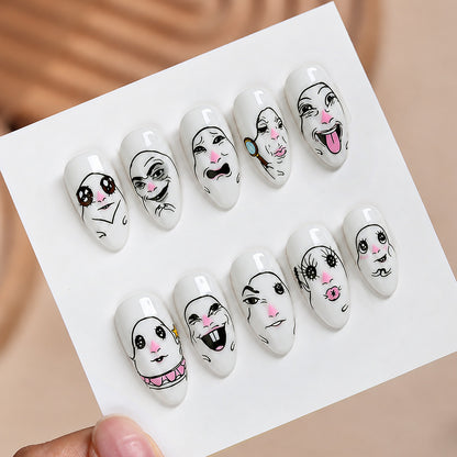 Kreatives Kunstnagelset mit Gesichtsmotiven Brehn