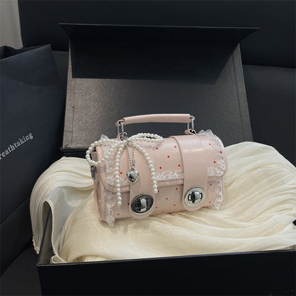 Dekorative kompakte Handtasche