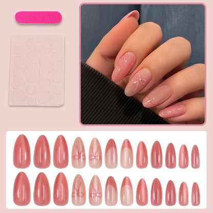 Kunstnagelset mit eleganten Schleifen und Glitzer Brehn