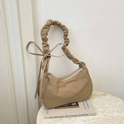 WoTexturiertes Stoff Sling Bag Brehn