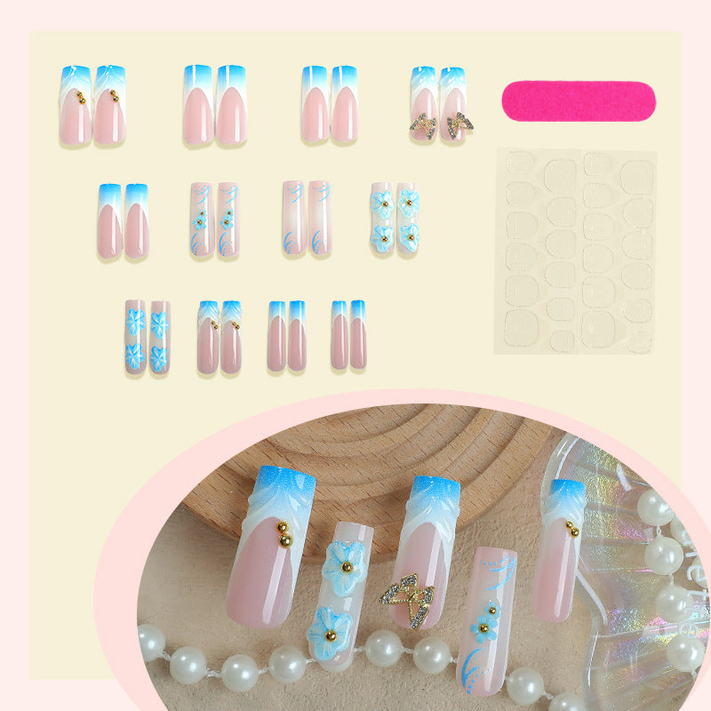 Künstlerisches Press-On-Nagel-Set mit floralen und Schmetterlingsdesigns Brehn