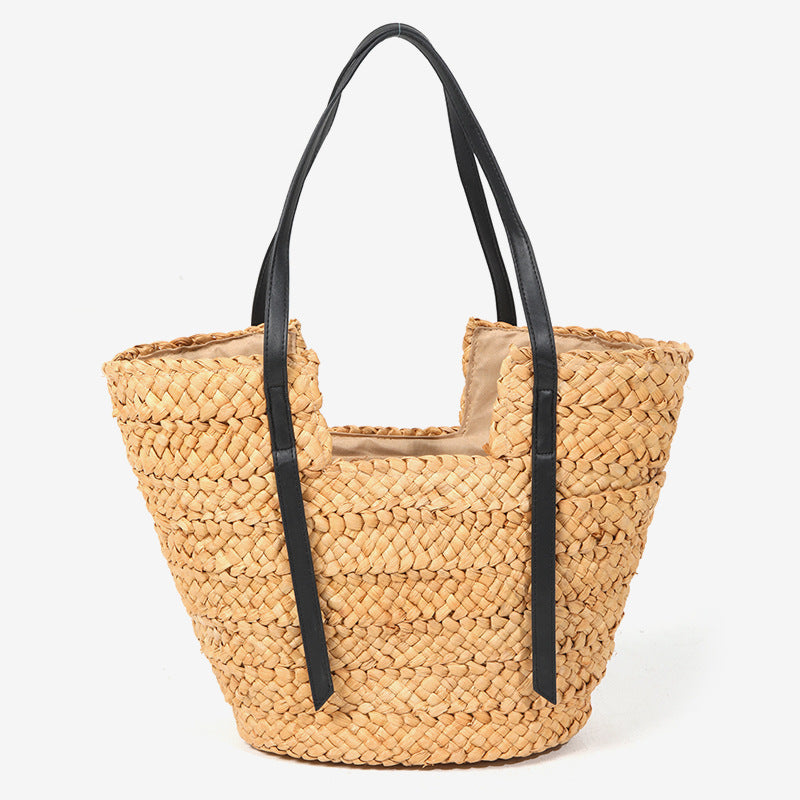 Damen Handtasche aus geflochtenem Naturmaterial mit eleganten Ledergriffen Brehn