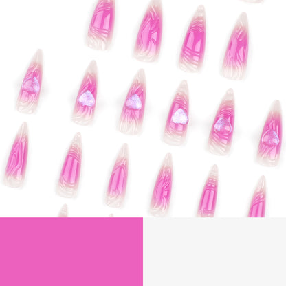 Kunstvolle Stiletto-Nägel mit Herz-Design und Glitzerakzenten Brehn